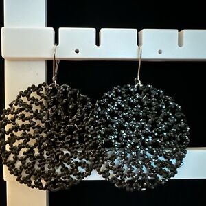 Round filigree pave black pierced crystal earrings
